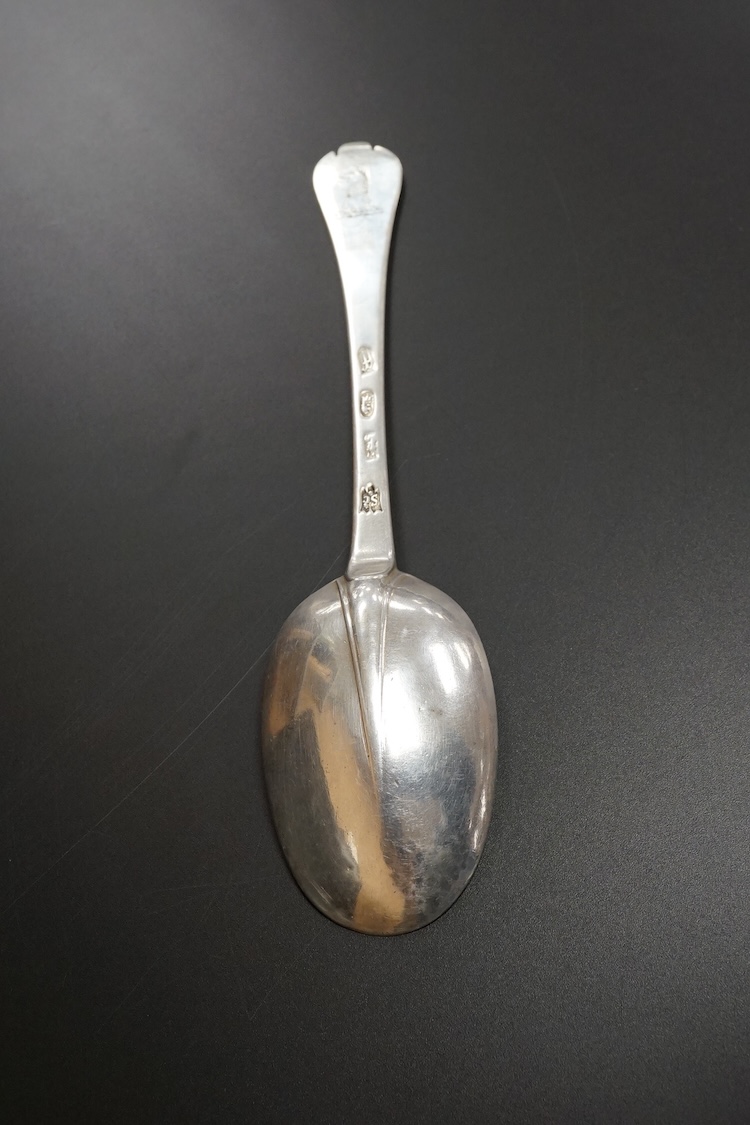 A late William III Britannia standard silver trefid spoon, by William Scarlett, London, 1701, with rat-tail bowl and later? engraved crest, 19.7cm, 52 grams.